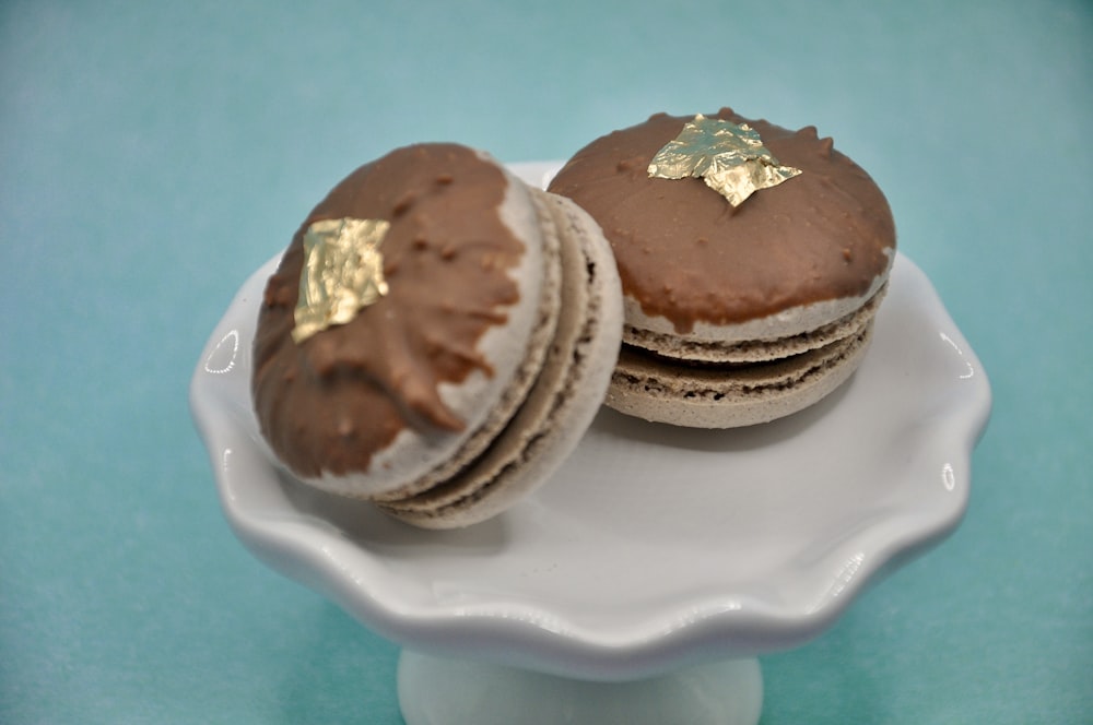 a white plate topped with chocolate covered cookies