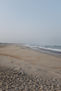 A serene beach scene with a traveler enjoying the sun.