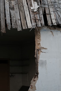 Before and after photos showcasing the transformation of a water-damaged area.