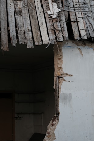 Before and after photos showcasing the transformation of a water-damaged area.