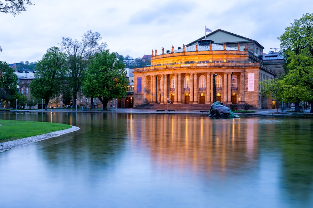 a large building sitting next to a body of water