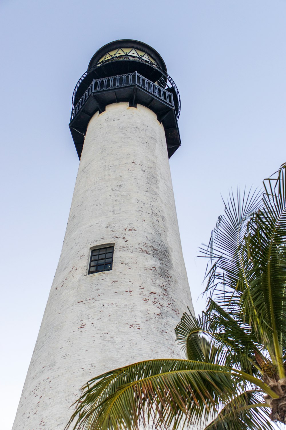 a tall white tower with a black top