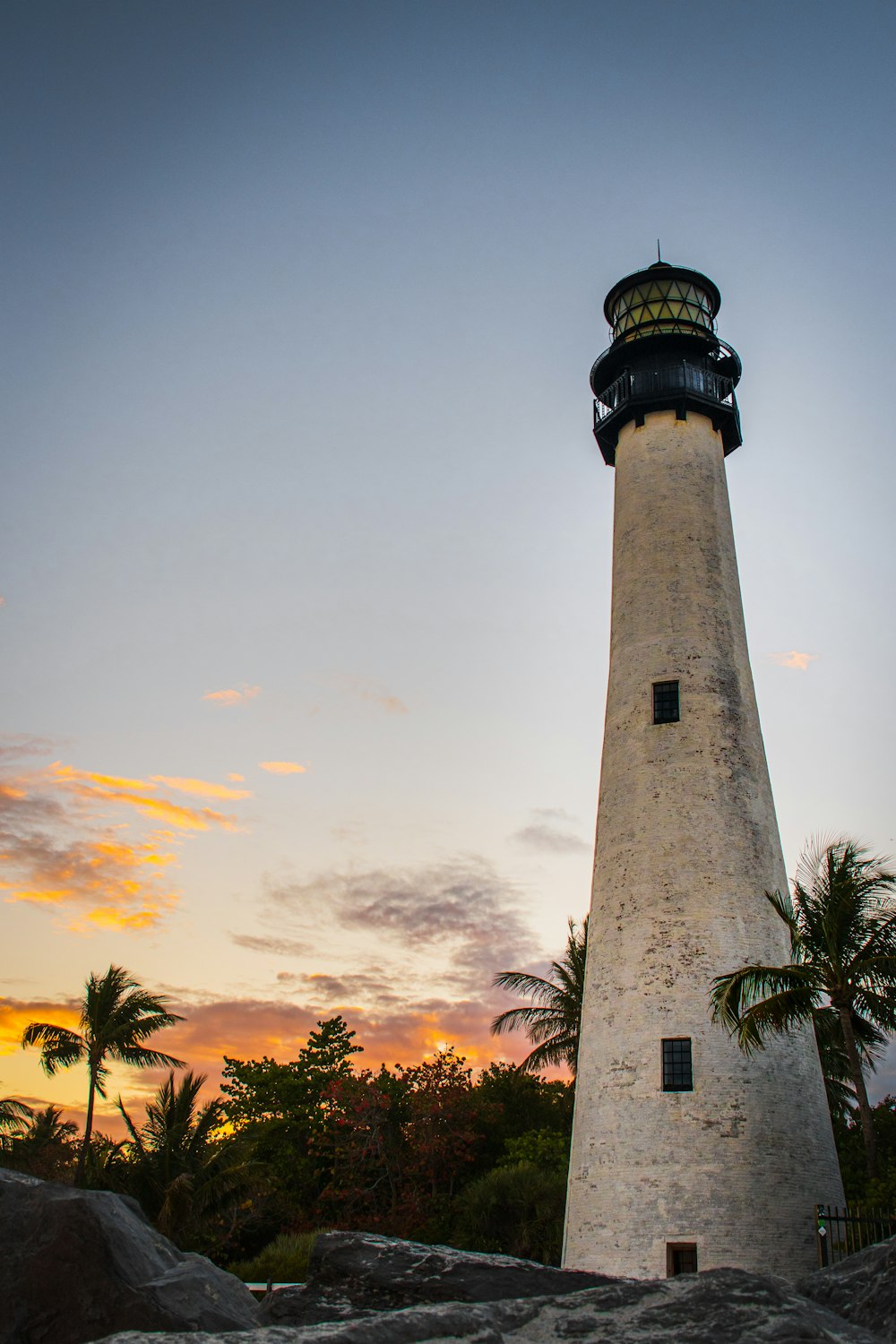 a light house sitting on top of a hill