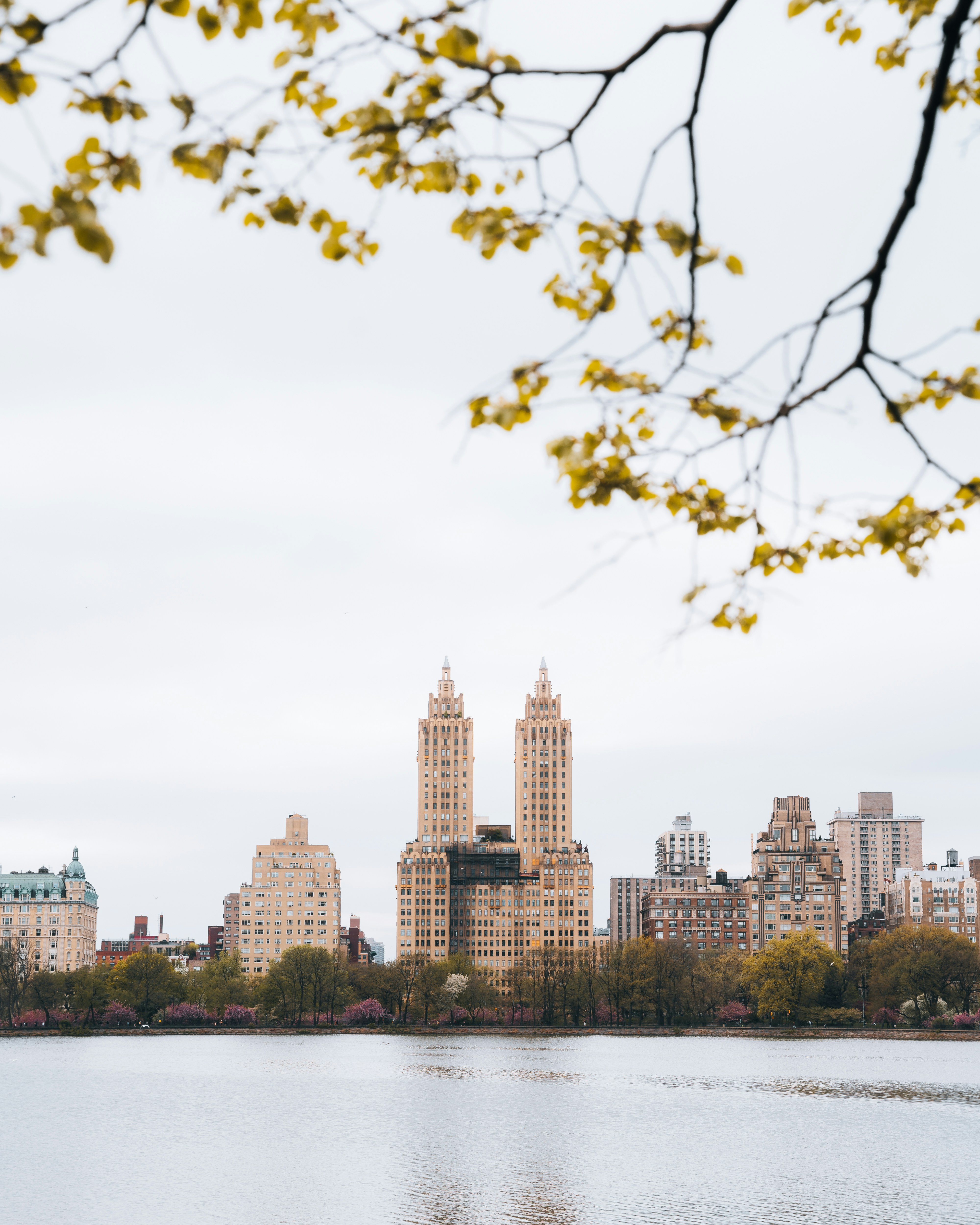 a large body of water with a city in the background