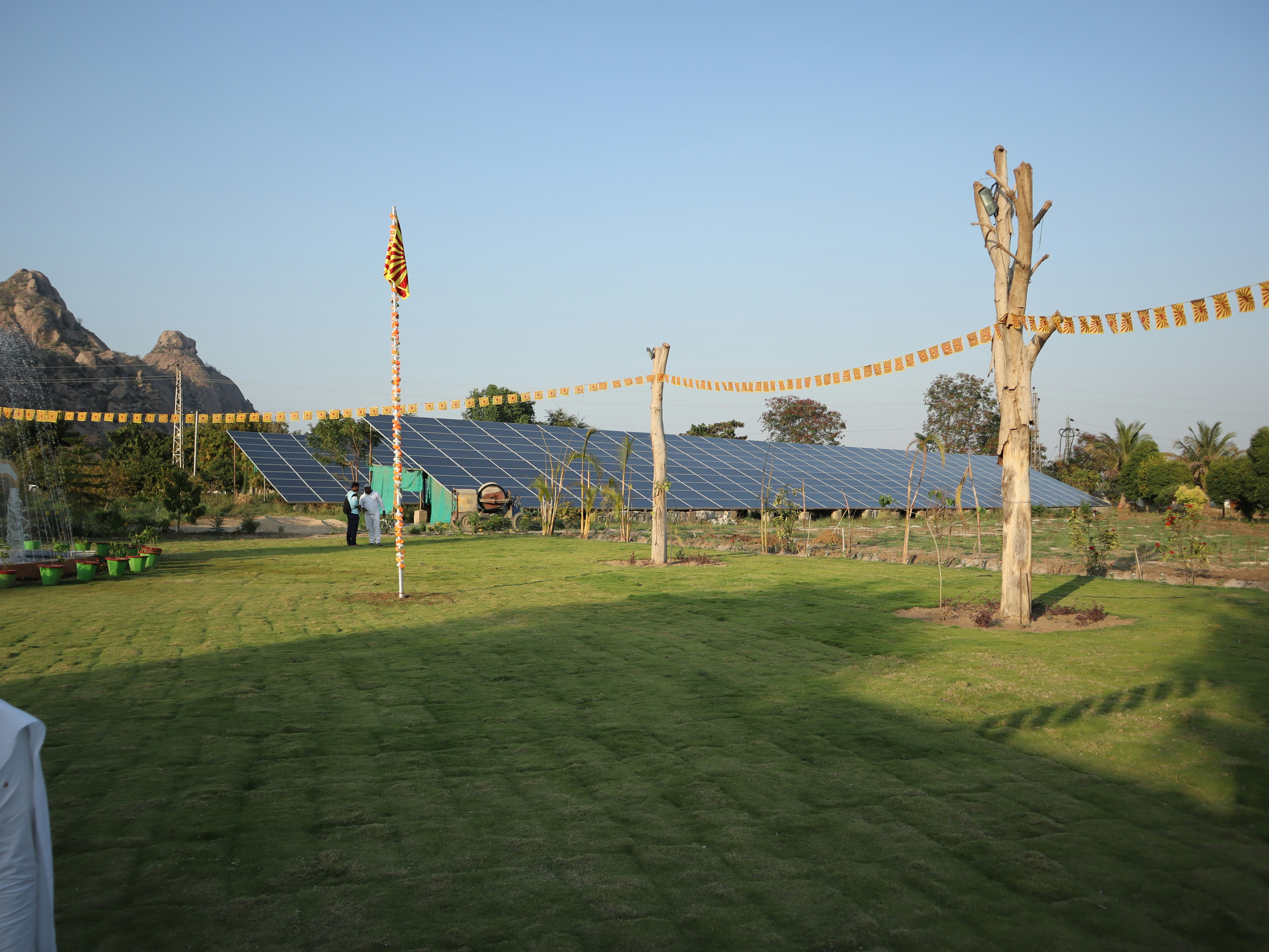 Solar panels on residential rooftop in UP town, four panels arranged in row, sunny weather