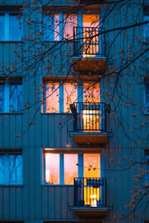 Evening shot of a home with glowing windows installed by New Windows Solution, creating a warm inviting atmosphere.