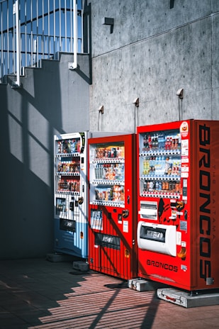 a row of vending machines sitting next to each other