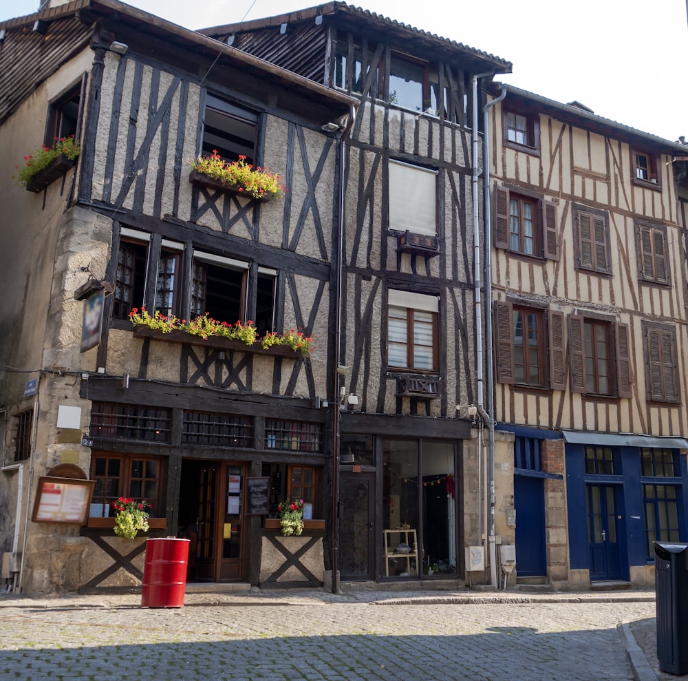 an old building with flower boxes on the windows