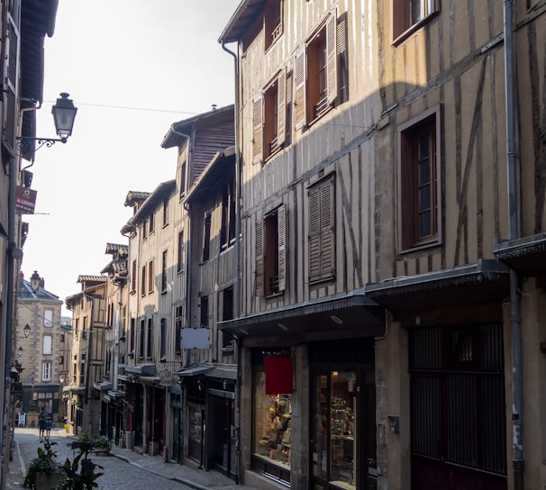 a cobblestone street lined with old buildings