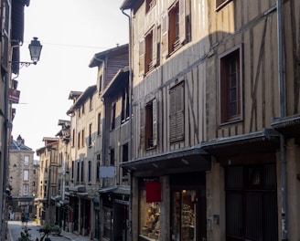 a cobblestone street lined with old buildings