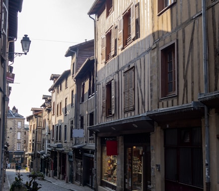 a cobblestone street lined with old buildings