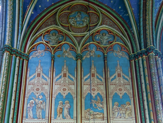 a church with a blue and white ceiling and a chandelier