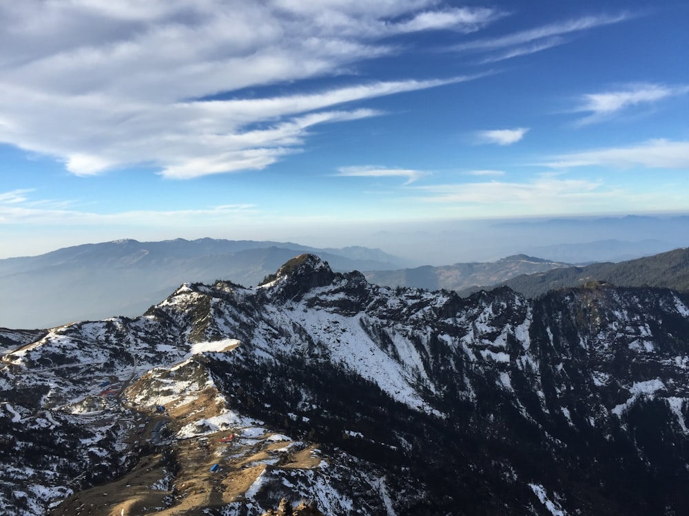 a view of a mountain range covered in snow