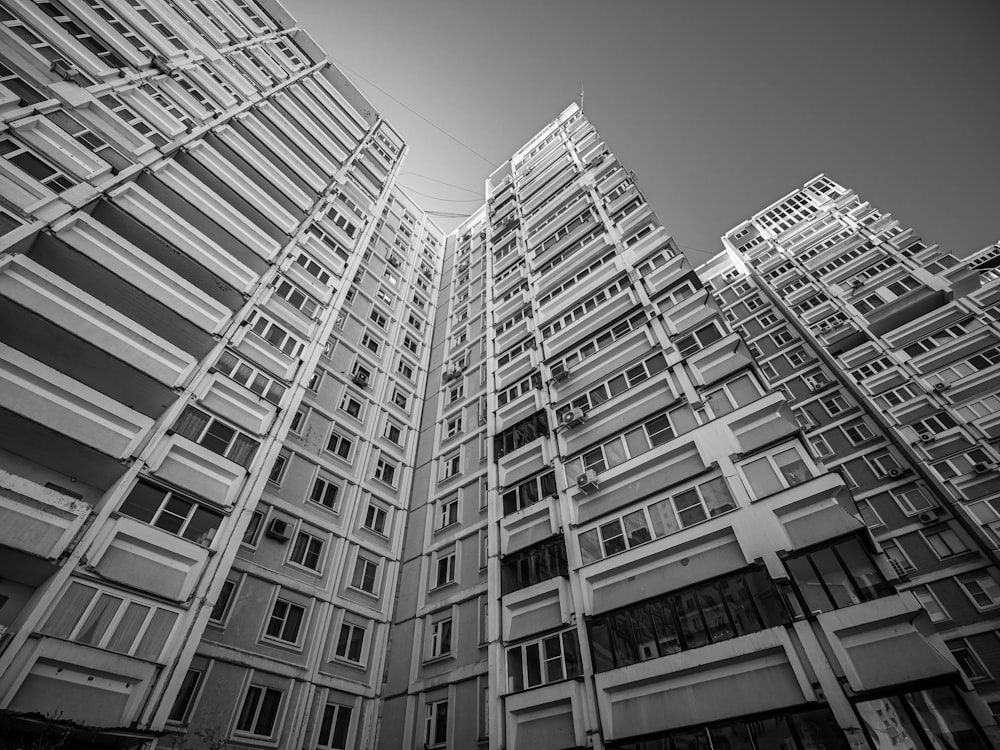 a black and white photo of tall buildings