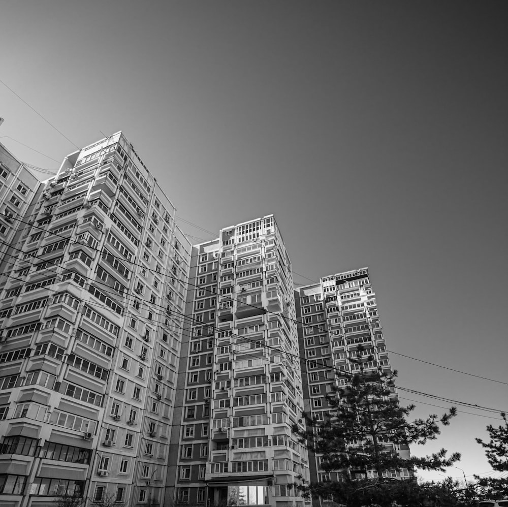 a black and white photo of some very tall buildings