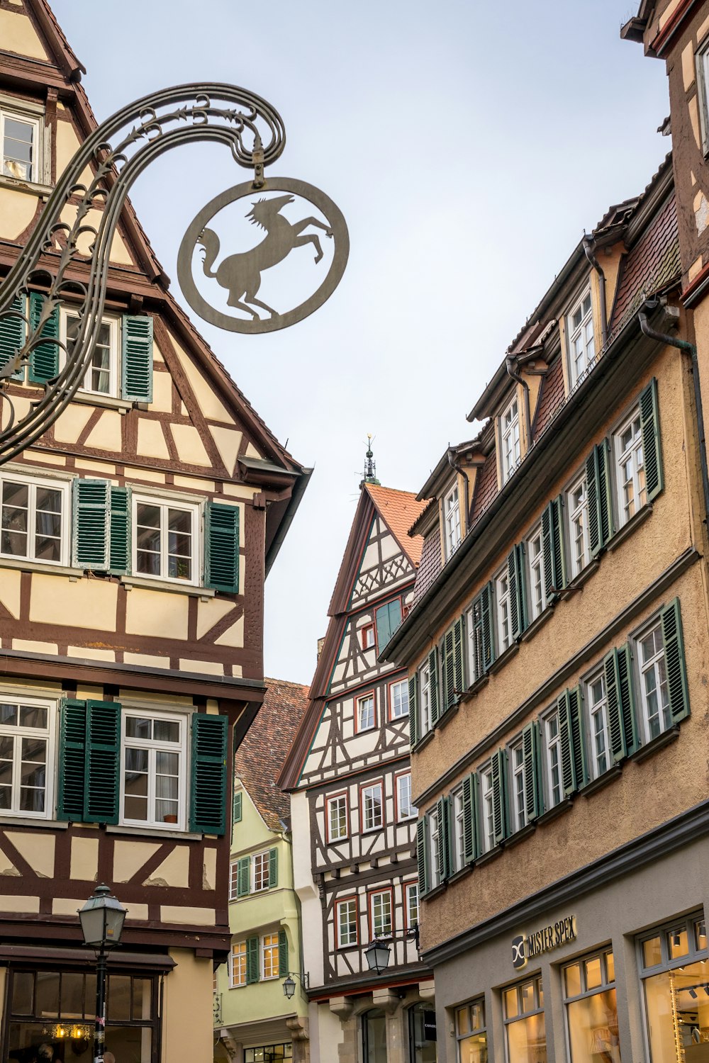 a street sign in front of a row of buildings