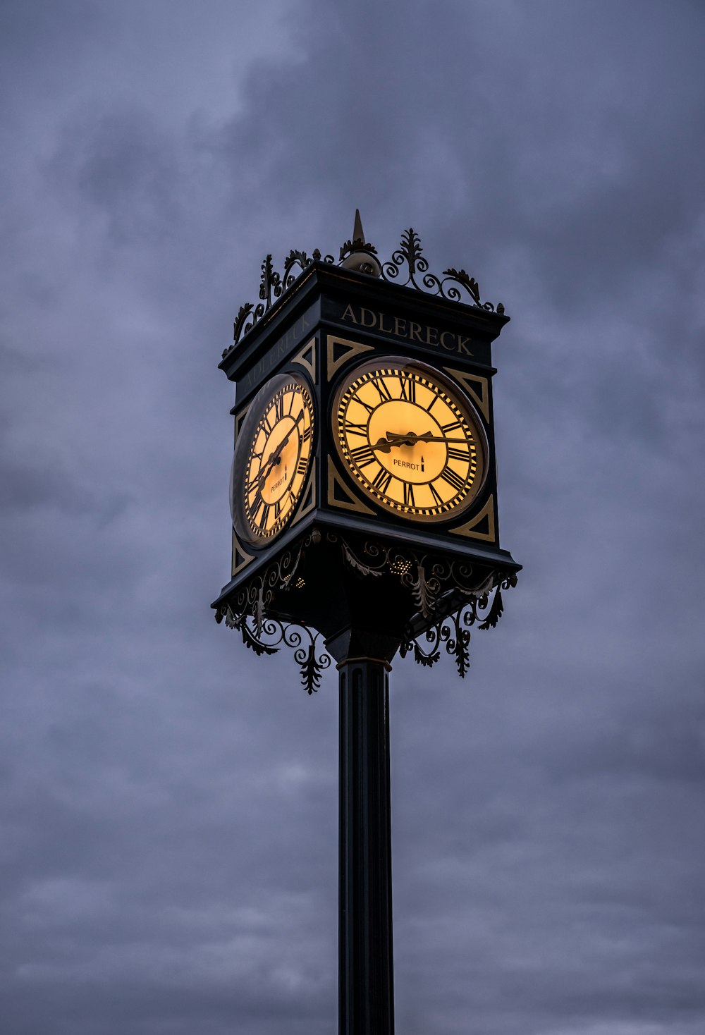 a clock tower with a cloudy sky in the background