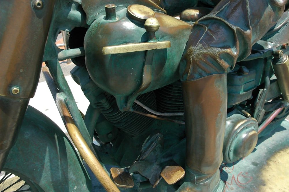 a close up of a green motorcycle engine
