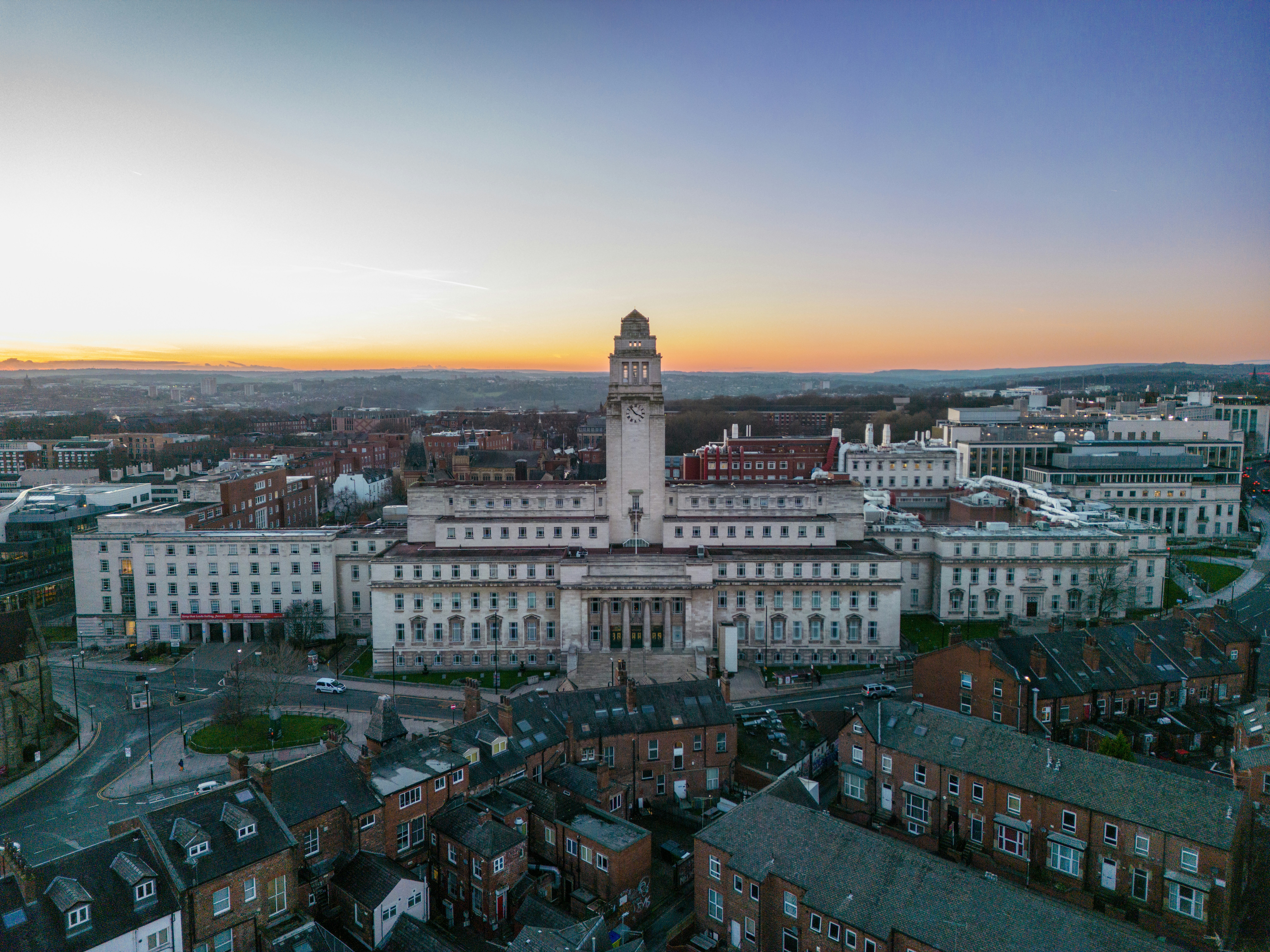 an aerial view of a city with a clock tower