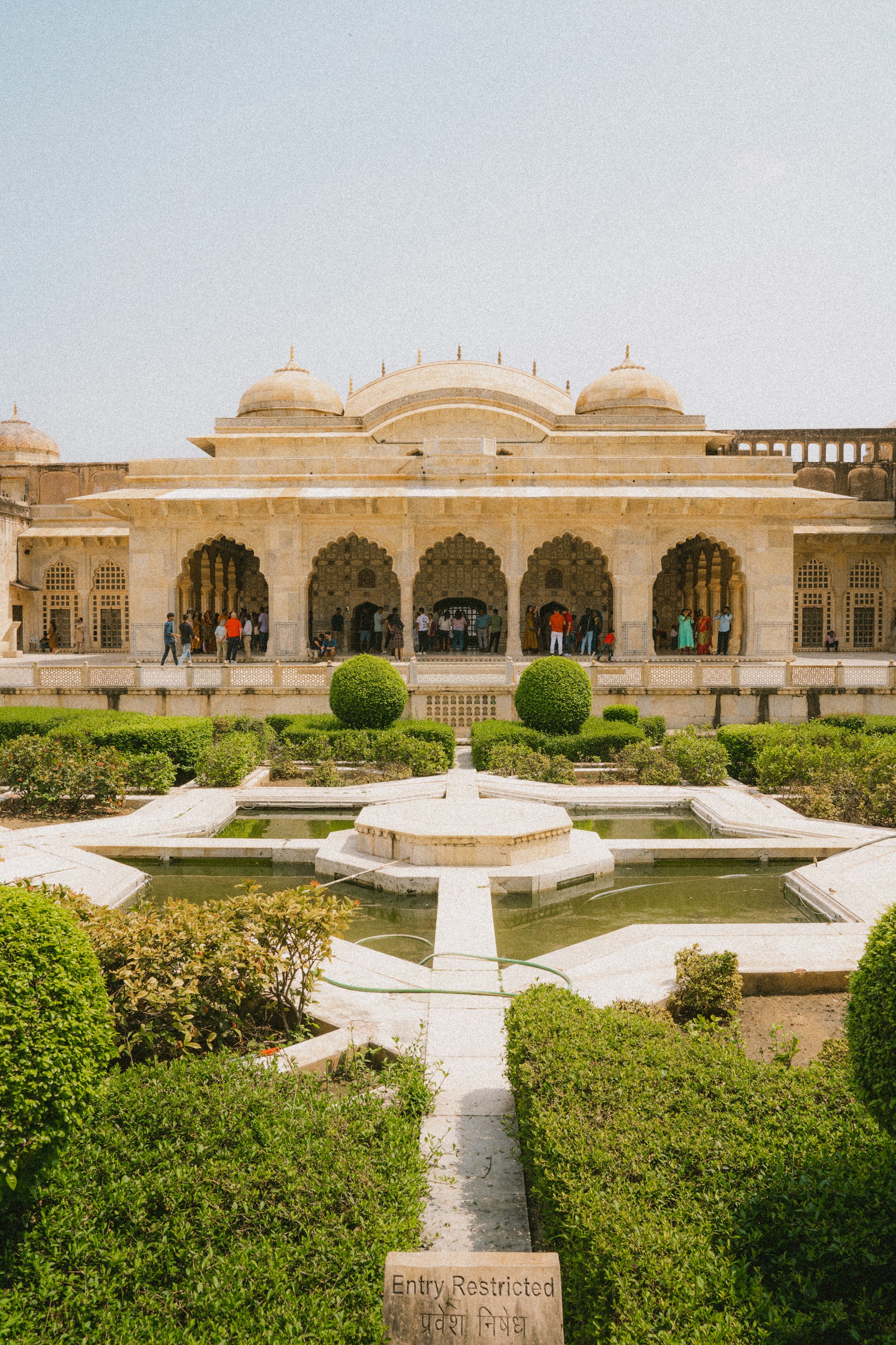 a large building with a fountain in front of it