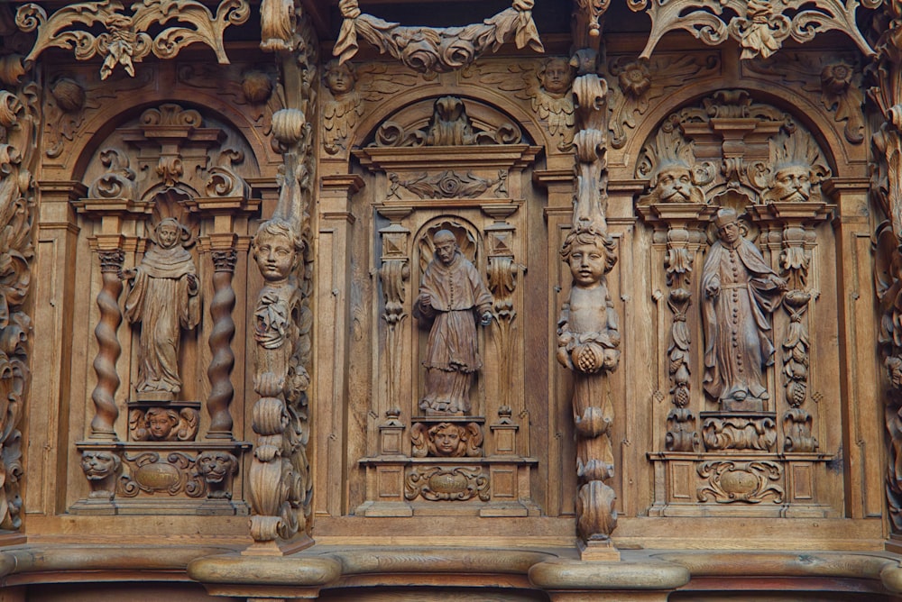 a close up of a building with carvings on it