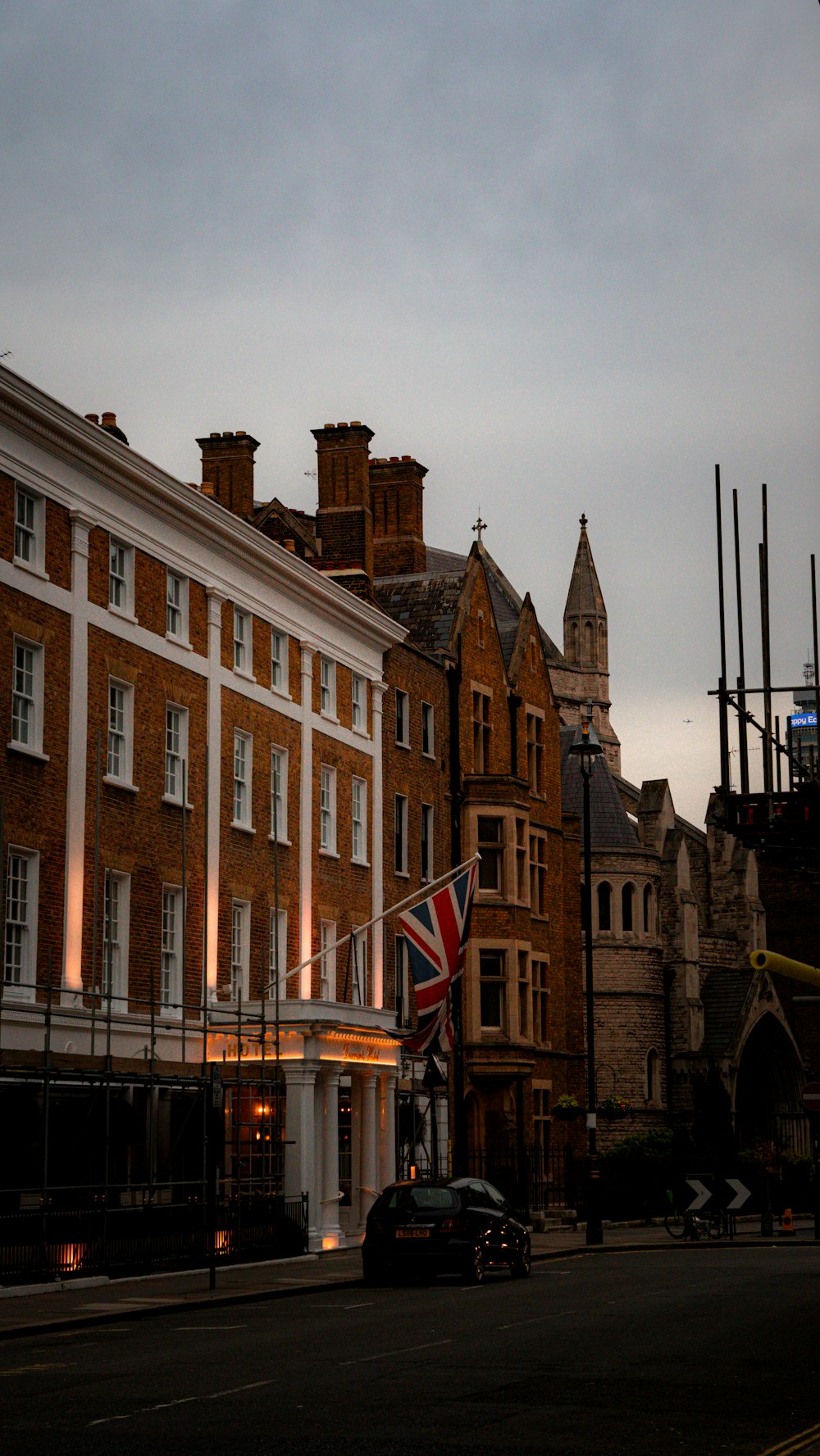 a british flag flying in front of a building