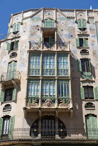 a tall building with lots of windows and balconies