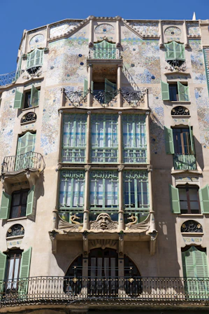 a tall building with lots of windows and balconies