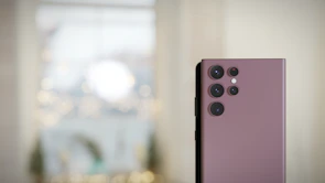 The iPhone 17's advanced camera system showcasing multiple lenses with a blurred cityscape background.