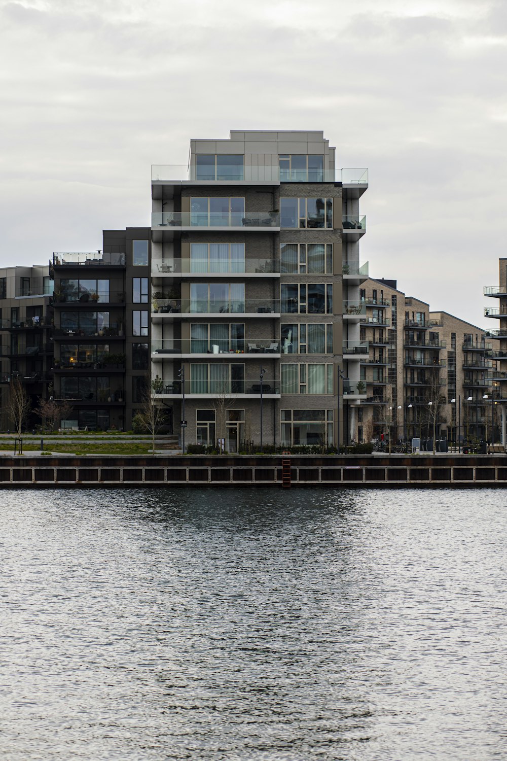 a body of water next to a large building