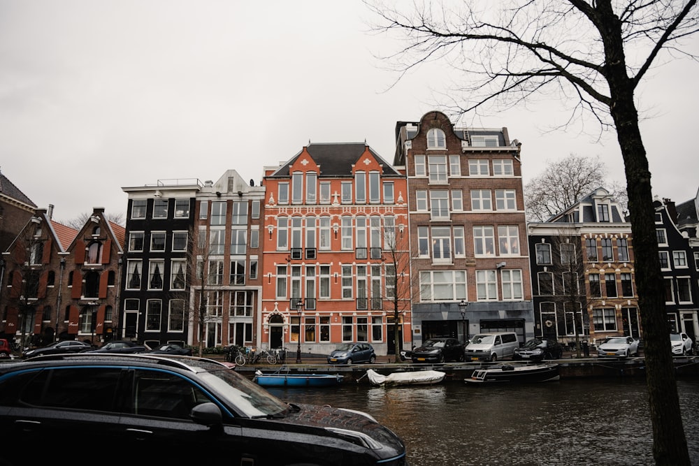 a group of buildings next to a body of water