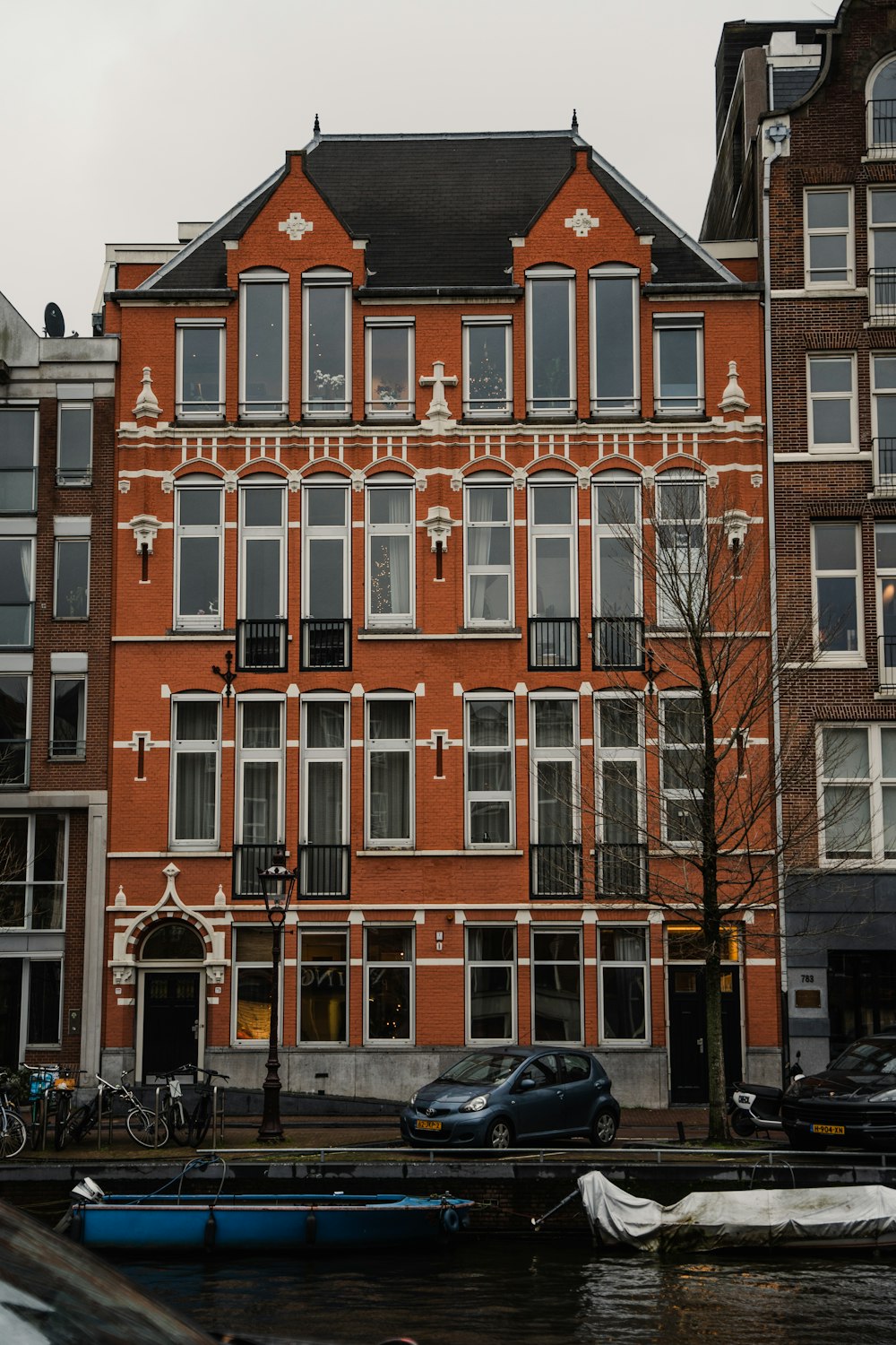 a large red brick building with lots of windows