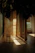 A serene, softly lit therapy room with gentle natural light filtering through sheer curtains.