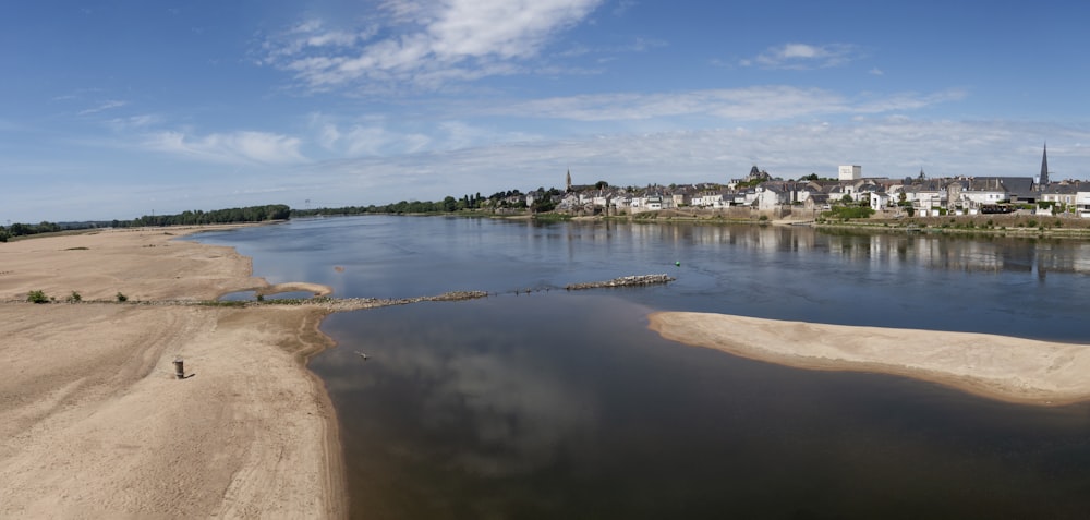 an aerial view of a river running through a town