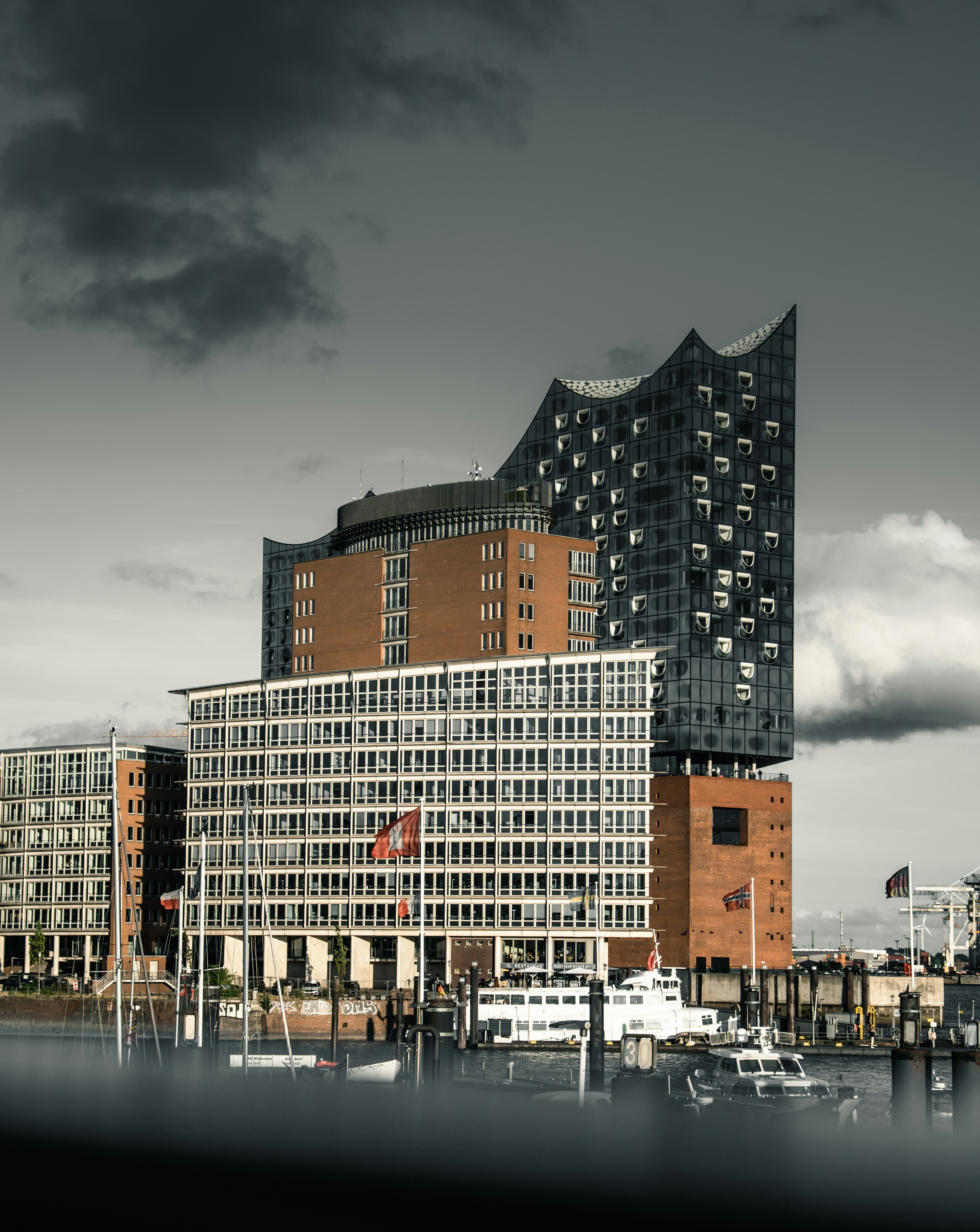 a very tall building sitting next to a body of water