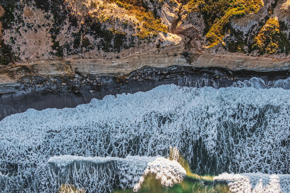 a bird's eye view of the water and cliffs