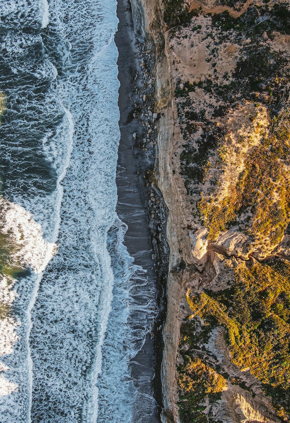 a bird's eye view of a beach and ocean