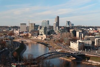 a river running through a city next to tall buildings