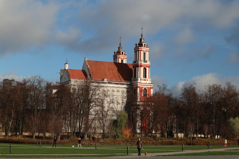 a large white building with a red roof