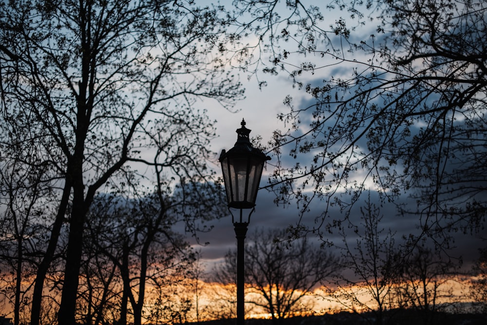 a street light in front of a cloudy sky