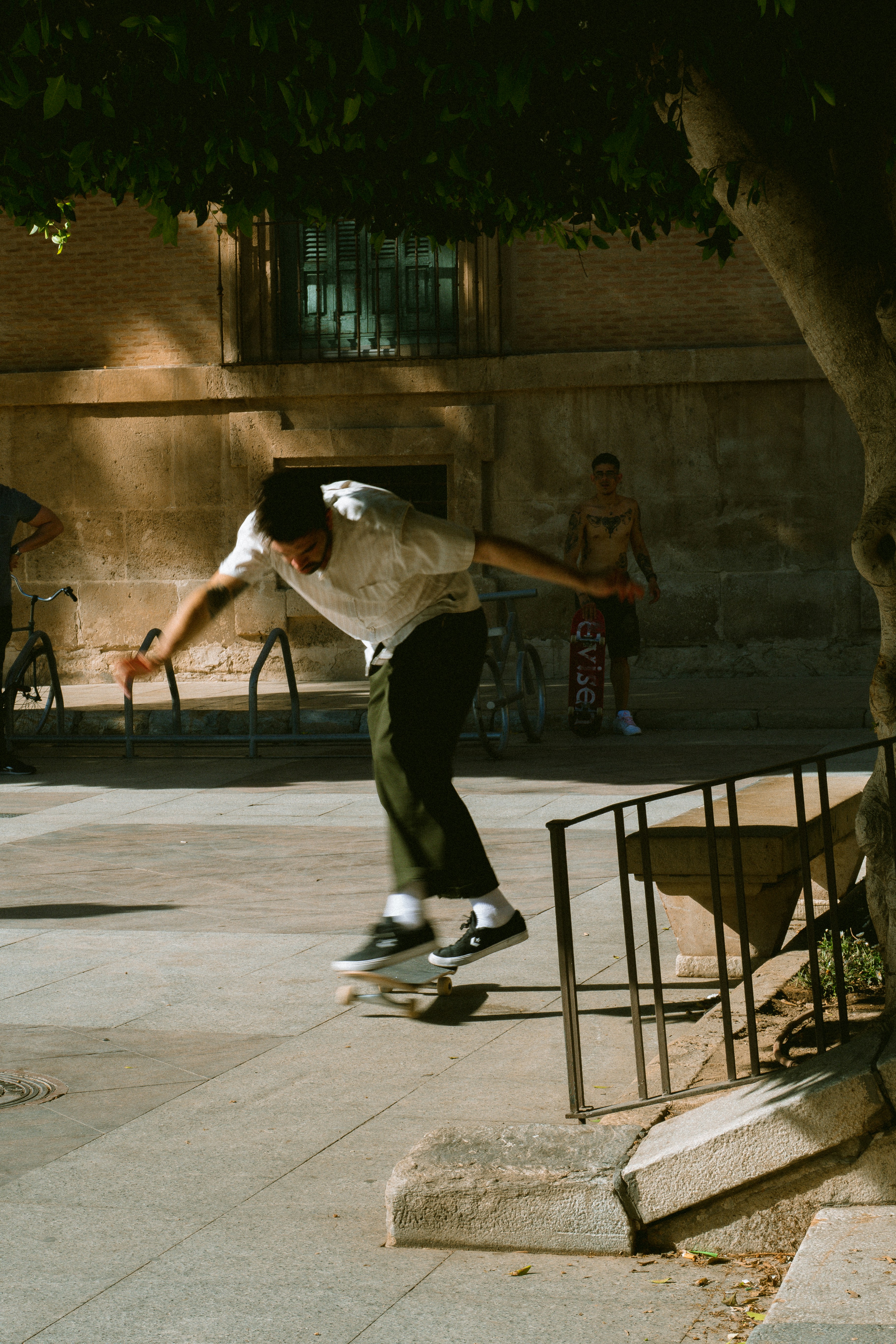 a man riding a skateboard down the side of a metal rail