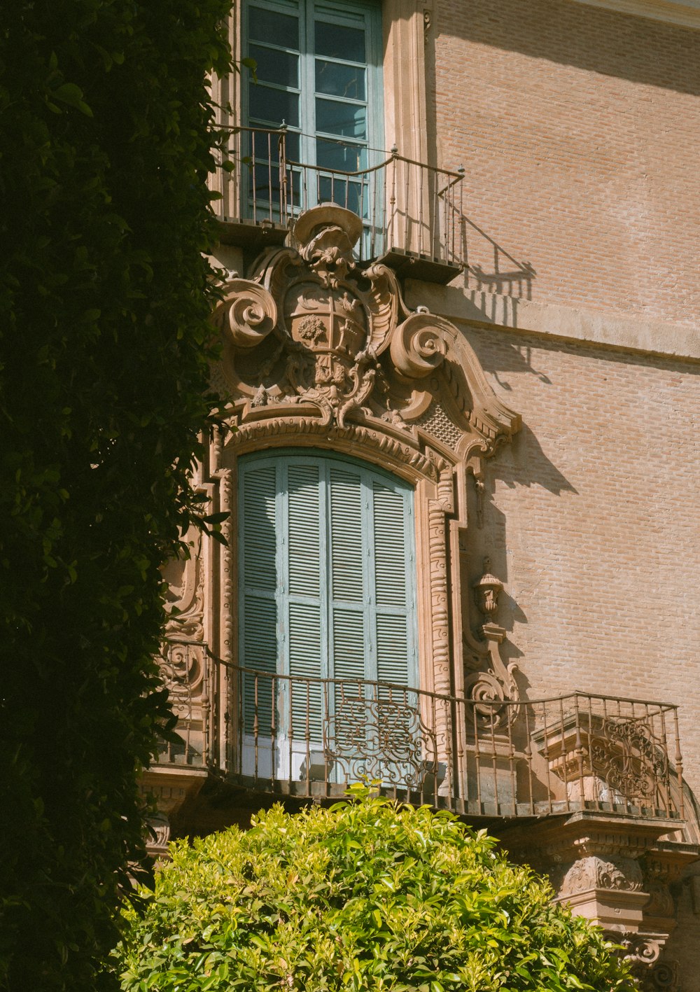 a building with a balcony and balcony railing