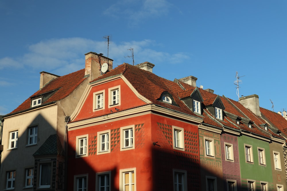 a row of buildings with a blue sky in the background
