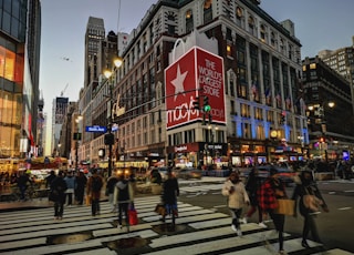 a group of people crossing a street at a crosswalk