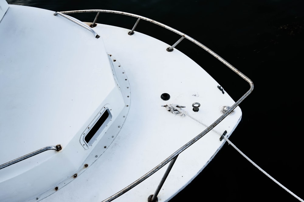a close up of a white boat in the water