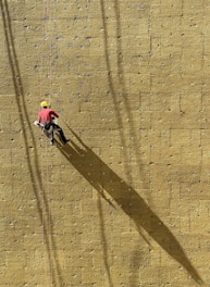 a man climbing up the side of a wall