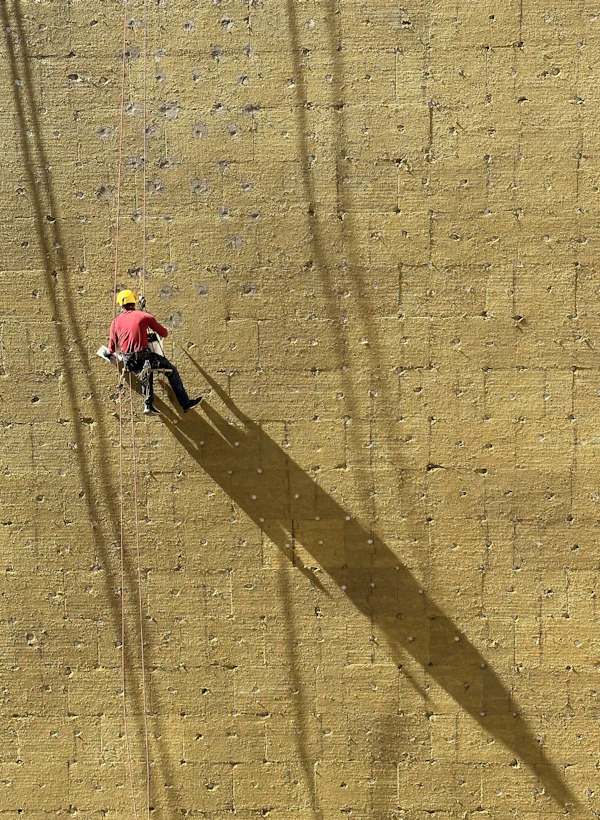 Worker on exterior wall