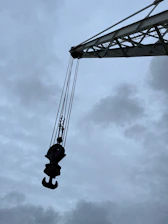 Heavy-duty lifting equipment in operation at an industrial site.