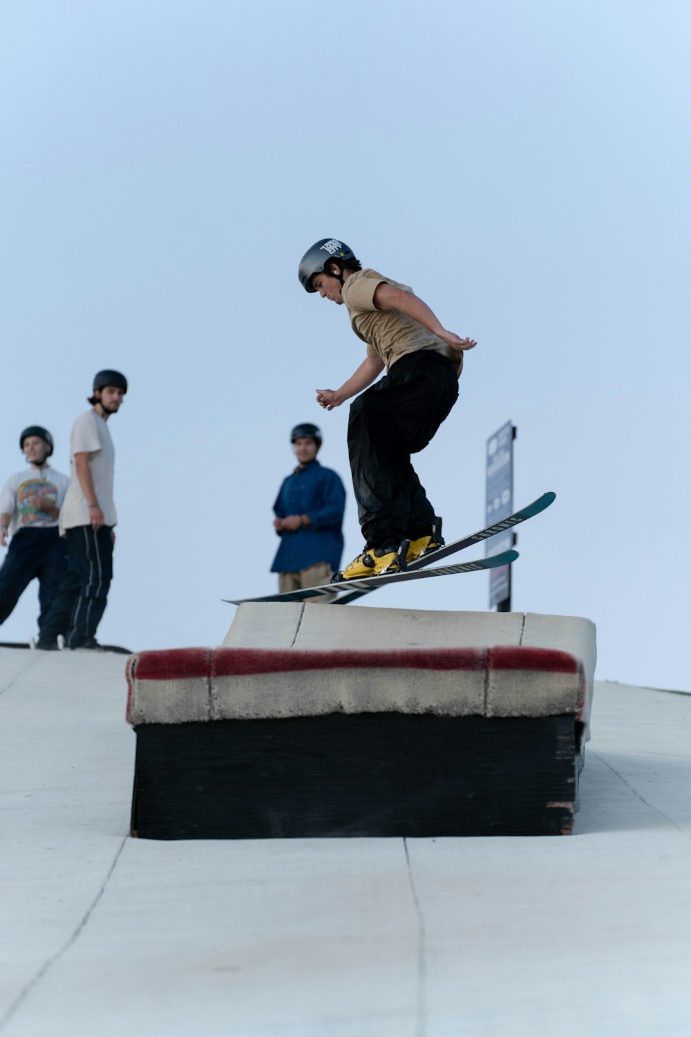 a man riding a snowboard down the side of a ramp