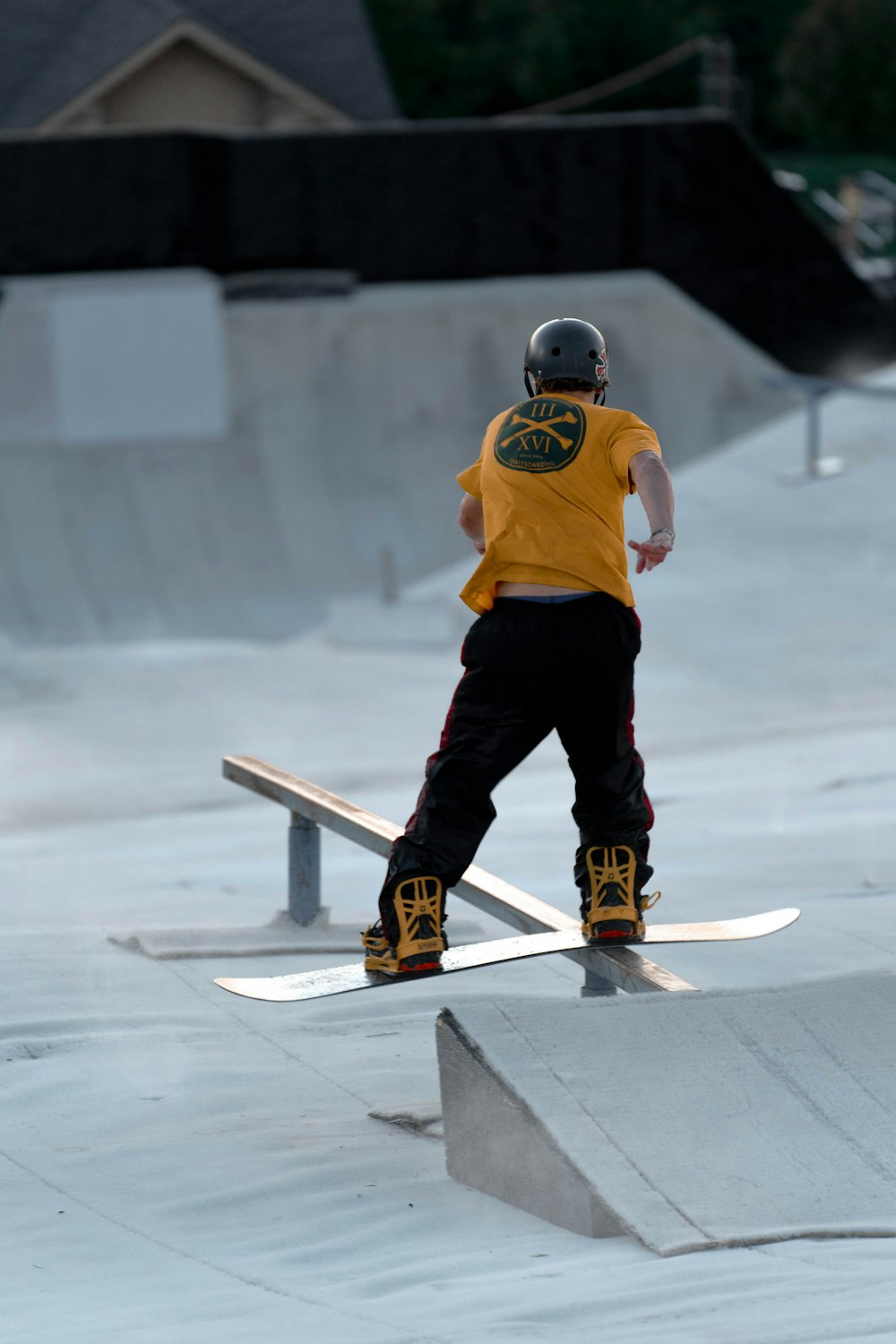 a man riding a snowboard on top of a ramp